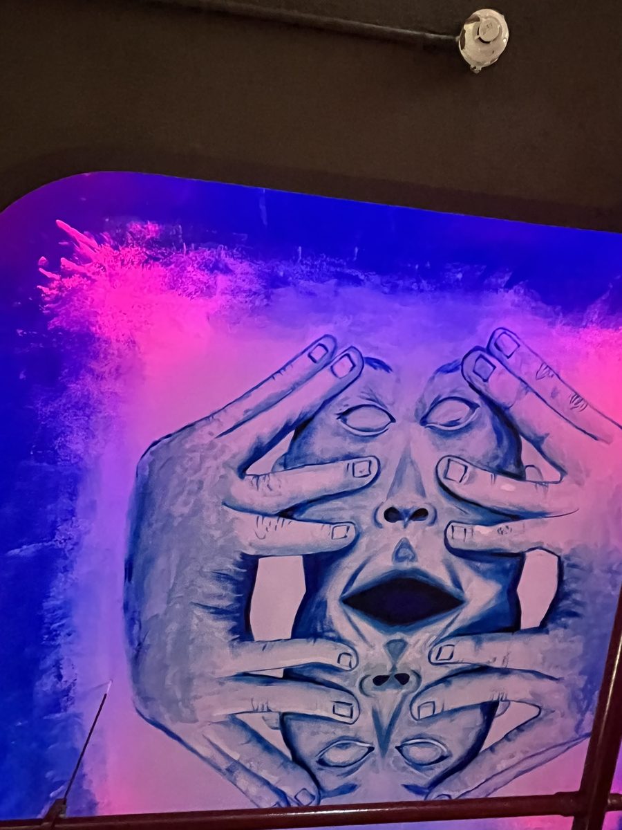 Surreal artwork on ceiling at Tatsav Cafe